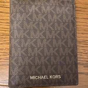 Michael Kors passport wallet.